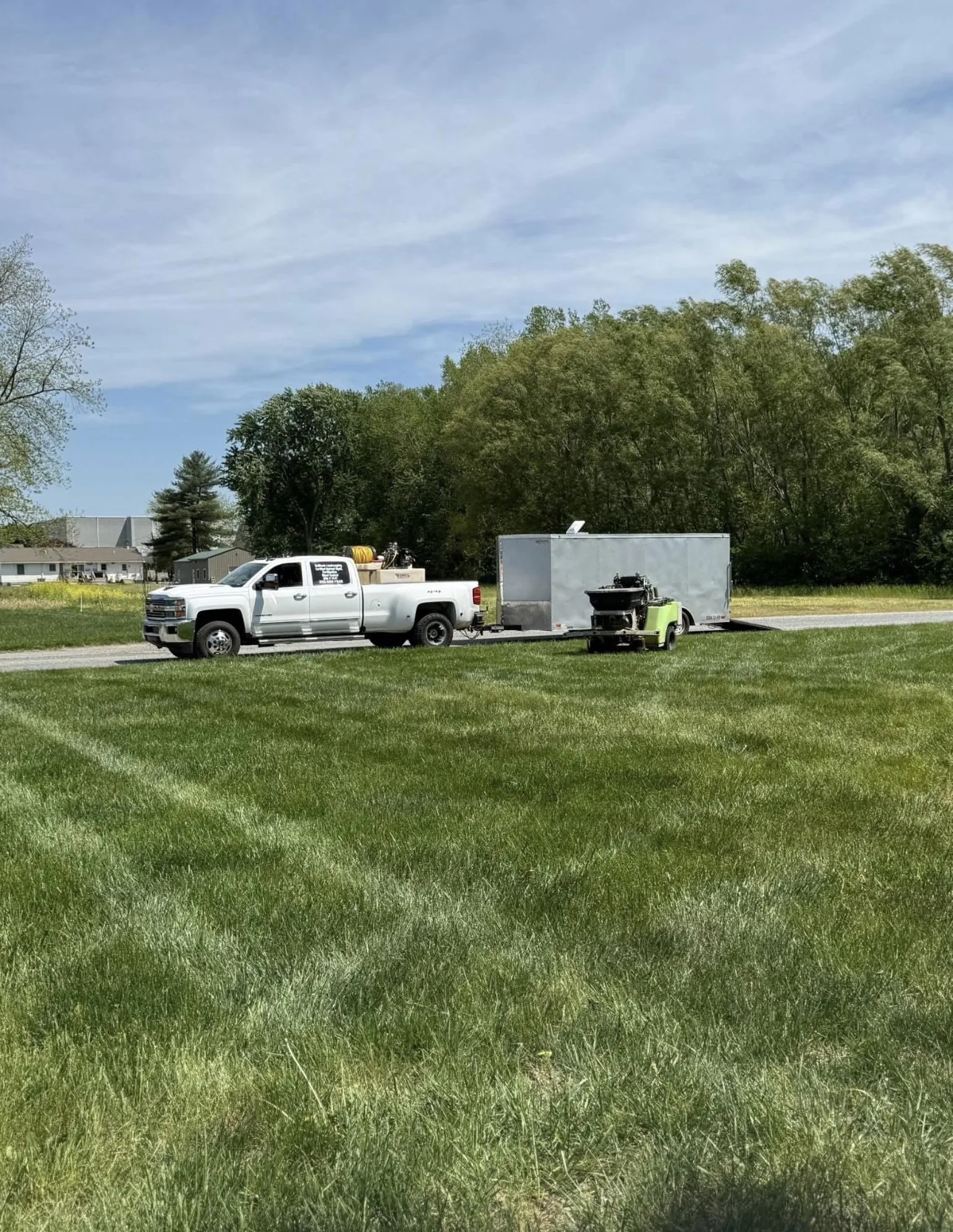DeBloois Landscaping truck and trailer on the job